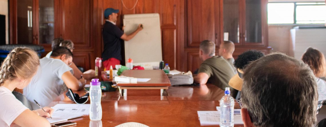 People in a classroom setting learning about the Chemistry Behind Aquaponics