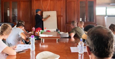 People in a classroom setting learning about the Chemistry Behind Aquaponics