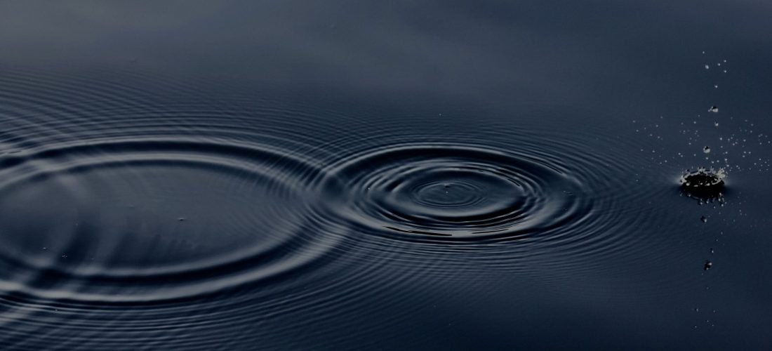 Water droplets on a water body of water